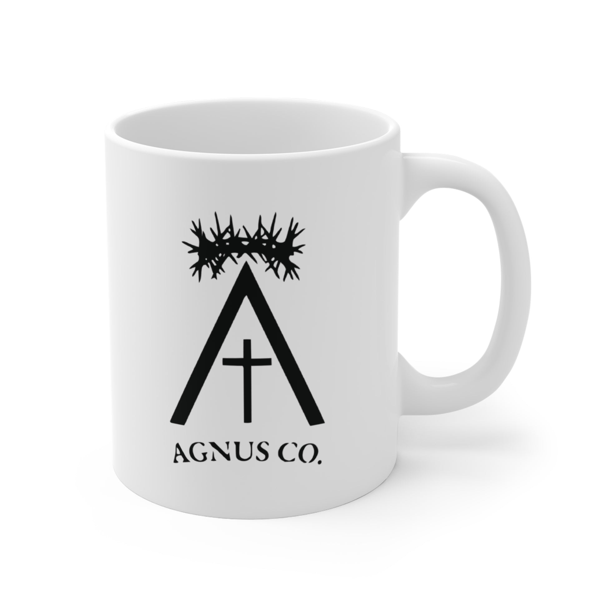 Agnus Co. Catholic coffee mug — front view with Agnus Co. logo and crown of thorns design