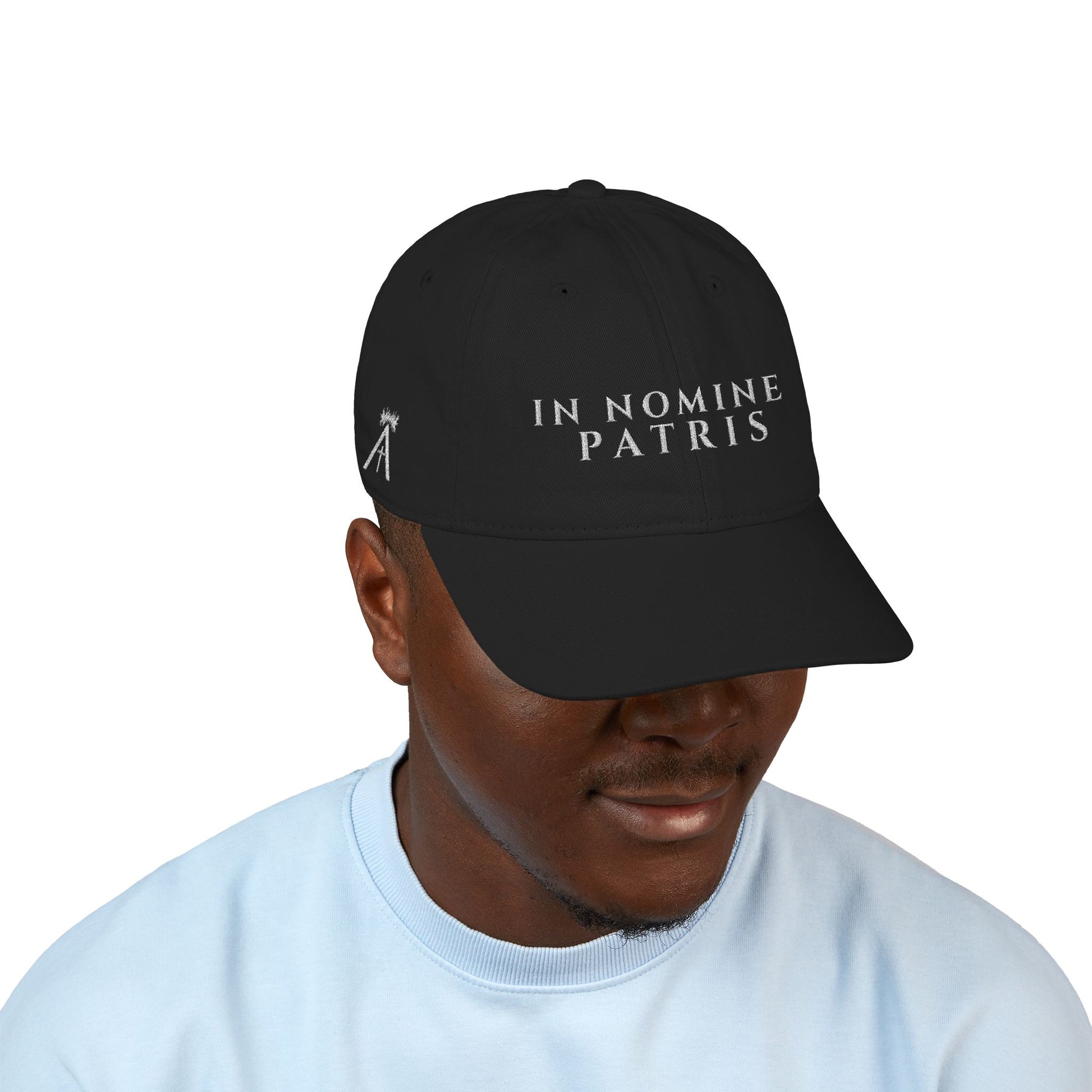 Agnus Co. In Nomine Patris black Catholic cap worn by model — side profile view